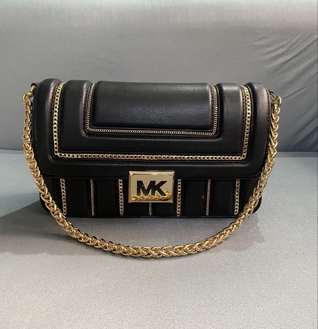 Michael Kors Sonia Medium Leather bag (Category: Luxury Bags & Wallets) located in Trece Martires City. Submitted by miladyoo9 (Listing ID 1459744805, Image 1). Description: Michael Kors Sonia Leather Crossbody bag - Medium size -With gold chain design - can be used as shoulder bag/hand bag or crossbody bag - slightly used (with minimal flaws- see photos).