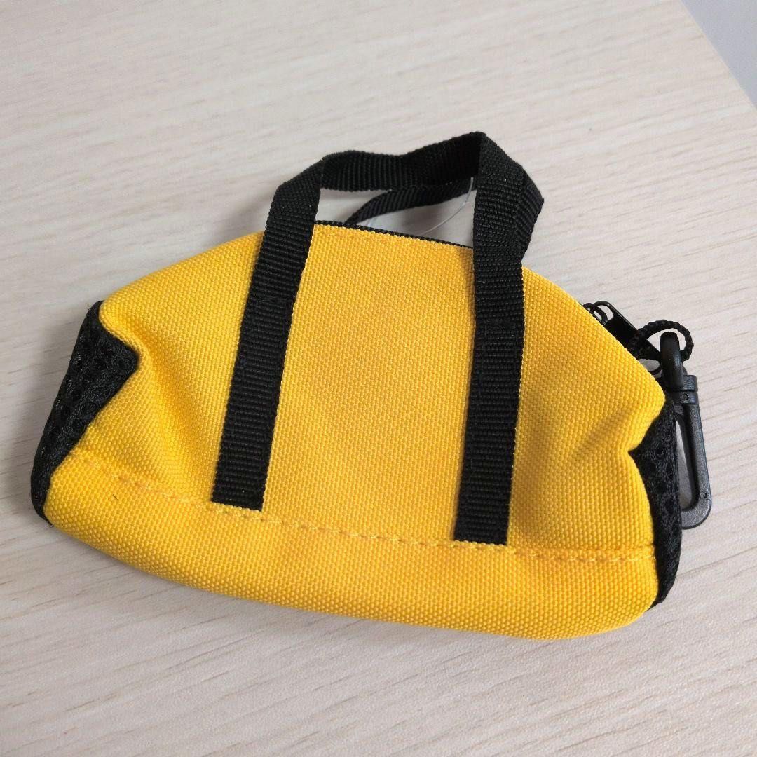 Mini Boston bag with key ring (Category: Wallets & Card holders) located in Manila. Submitted by wondermoma.ph (Listing ID 1459862776, Image 3). Description: Material: Body: Polyester Product Size: Body Size: W11 x D5 x H12cm, Total Length: 17cm, Quantity: 1 piece Colors: Black, Yellow For storing small items.