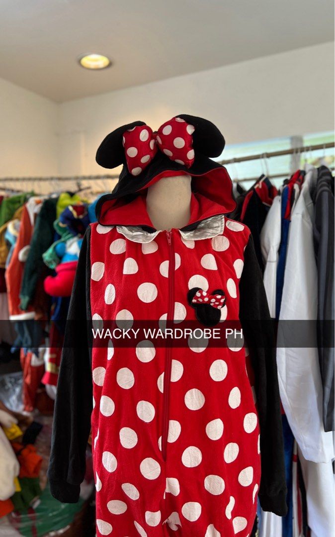 Minnie Mouse Polka Dot Onesie (Category: Coats, Jackets and Outerwear) located in Rizal. Submitted by kate_declutterr (Listing ID 1459810577, Image 2). Description: - Adorable Minnie Mouse onesie design - Classic red with white polka dots - Black sleeves and hood - Features iconic Minnie ears and bow on top - Convenient front zipper closure - Made from soft and comfortable material - Perfect for lounging at home or as a fun costume.
