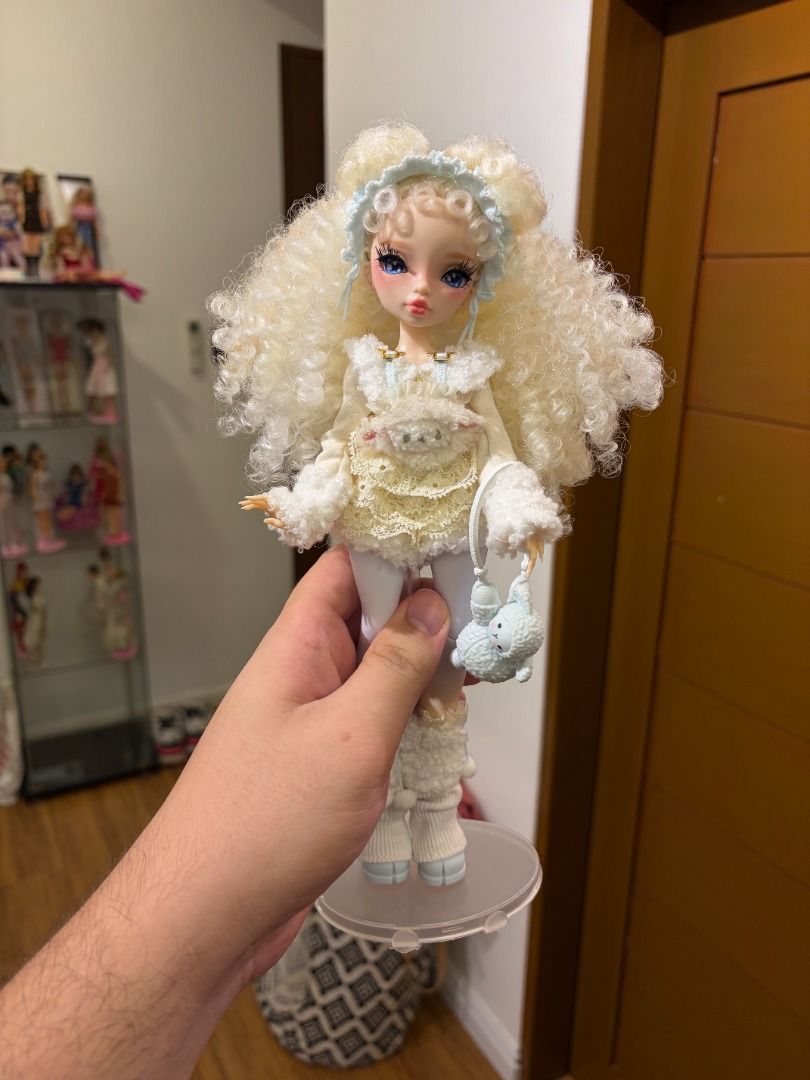 Mirror Mi Shai Meadows Doll (Category: Kids Toys) located in Manila. Submitted by wilpershendrik2003 (Listing ID 1459815927, Image 1). Description: - Brand: Mirror Mi - Model: Shai Meadows Doll - Hair: Fluffy, curly blonde - Outfit: Cozy white with pastel details - Accessories: Includes a cute cloud charm - Condition: Excellent, well-maintained - Design: Adorable and unique doll.