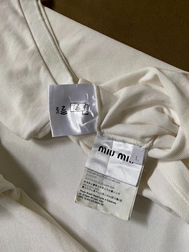 Miu Miu Polo Shirt (Category: Others Tops) located in Quezon City. Submitted by maeee_99 (Listing ID 1459796971, Image 3). Description: Miu Miu Polo - Authentic - Color: White - Embroidered Logo - Dimension: 21 x 25 - Color Rate: 9/10 DM🩷📩.