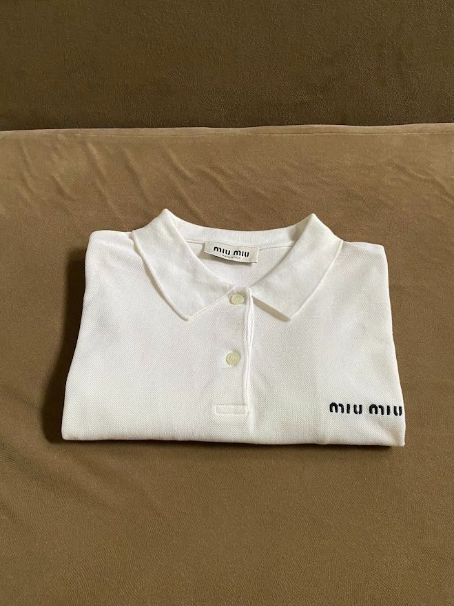 Miu Miu Polo Shirt (Category: Others Tops) located in Quezon City. Submitted by maeee_99 (Listing ID 1459796971, Image 1). Description: Miu Miu Polo - Authentic - Color: White - Embroidered Logo - Dimension: 21 x 25 - Color Rate: 9/10 DM🩷📩.