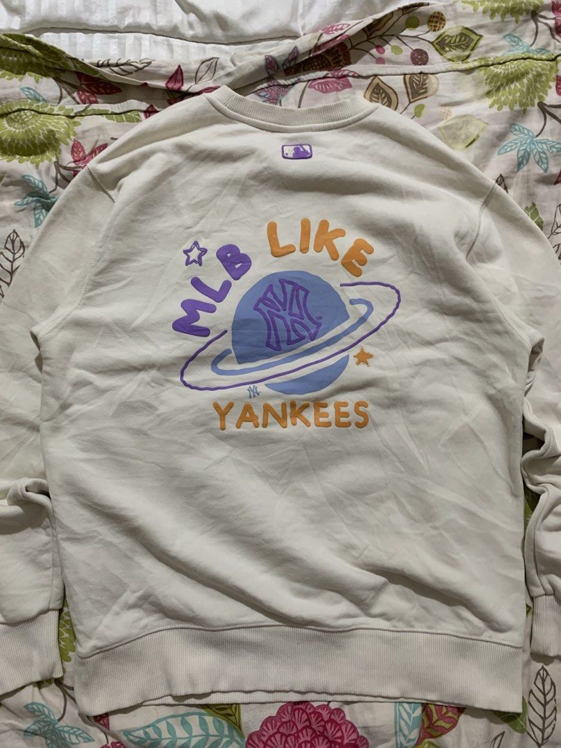 MLB New York Yankees Graphic Sweatshirt (Category: Coats, Jackets and Outerwear) located in Manila. Submitted by wild.just_trift (Listing ID 1459822406, Image 3). Description: - Cream colored MLB sweatshirt - Features a fun graphic on the back with the Yankees logo and 'MLB Like Yankees' - Smaller NY logo on the front - Comfortable crewneck style - Ideal for any Yankees fan mlb as pack size M-L color rate white 10/10 color rate black 8.5/10 excel