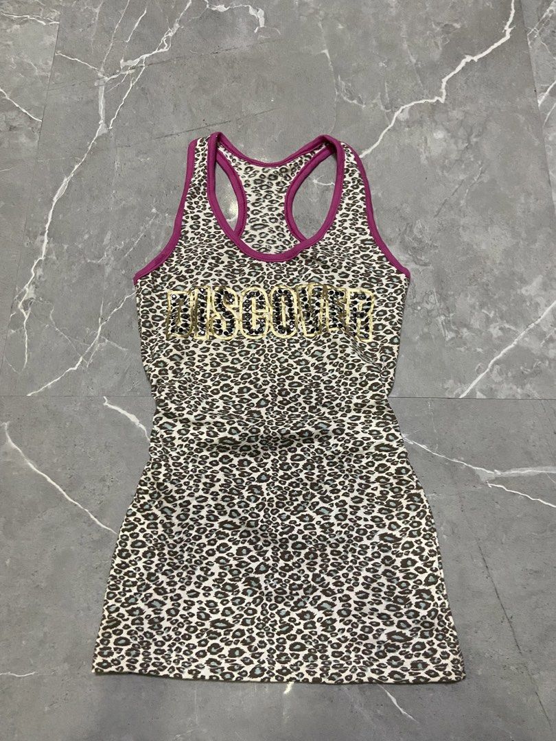 Moschino Leopard Print Tank Top with Sequins (Category: Sleeveless) located in Cebu City. Submitted by trueforest_k (Listing ID 1459691396, Image 1). Description: - Moschino leopard print tank top - Features gold sequins spelling out the brand name - Racerback style with purple trim - Fun and eye-catching design - Ideal for casual wear or workouts.