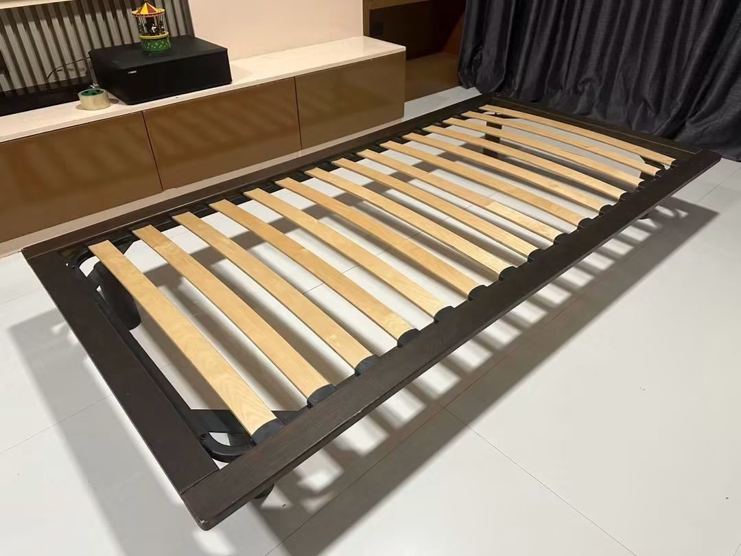 Muji floating bed (Category: Bed Frames & Mattresses) located in Makati City. Submitted by candyhinojales (Listing ID 1459807429, Image 1). Description: - Dark brown single bed frame - Sturdy wooden slats for mattress support - Simple, modern design - Ideal for small rooms or guest beds - Easy to assemble - Mattress not included.