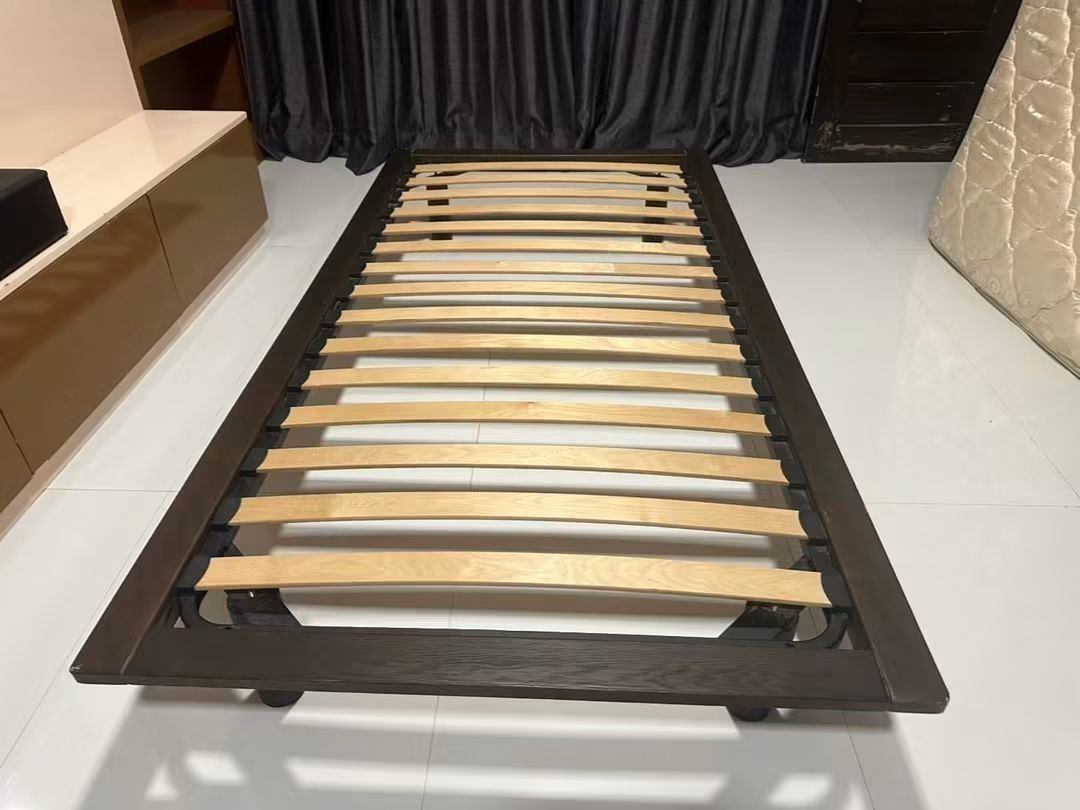 Muji floating bed (Category: Bed Frames & Mattresses) located in Makati City. Submitted by candyhinojales (Listing ID 1459807429, Image 2). Description: - Dark brown single bed frame - Sturdy wooden slats for mattress support - Simple, modern design - Ideal for small rooms or guest beds - Easy to assemble - Mattress not included.