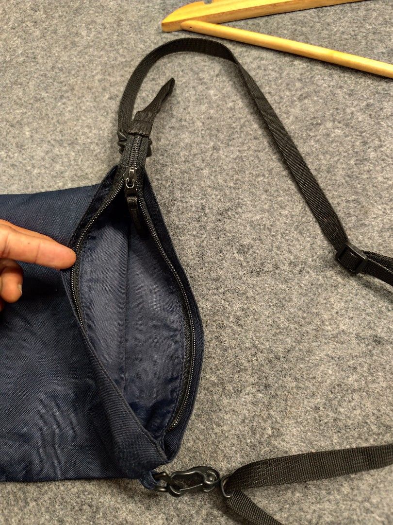 MUJI Navy Blue Crossbody Bag (Category: Sling Bags) located in Cordova. Submitted by bsb.streetluxvintage.clothing (Listing ID 1459783085, Image 3). Description: - Navy blue MUJI crossbody bag - Made in Vietnam - Main zippered compartment - Adjustable strap with buckle closure - Simple and functional design - Ideal for everyday use.