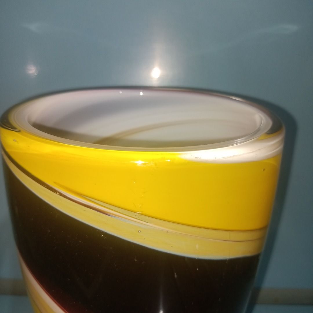 Murano Style Swirl Glass Vase (Category: Vases & Decorative Bowls) located in Munoz. Submitted by larryc1212 (Listing ID 1459813637, Image 3). Description: - Eye-catching swirl pattern glass vase - Vibrant colors: Yellow, Black, Red, White - Ideal size for small bouquets (approx. 7.75 inches tall) - Adds a stylish touch to any home decor - Issue only scratches Disclaimer: Item may include some scratches due to age, as is were is basis Item can be
