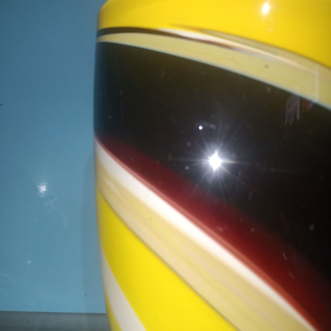 Murano Style Swirl Glass Vase (Category: Vases & Decorative Bowls) located in Munoz. Submitted by larryc1212 (Listing ID 1459813637, Image 2). Description: - Eye-catching swirl pattern glass vase - Vibrant colors: Yellow, Black, Red, White - Ideal size for small bouquets (approx. 7.75 inches tall) - Adds a stylish touch to any home decor - Issue only scratches Disclaimer: Item may include some scratches due to age, as is were is basis Item can be
