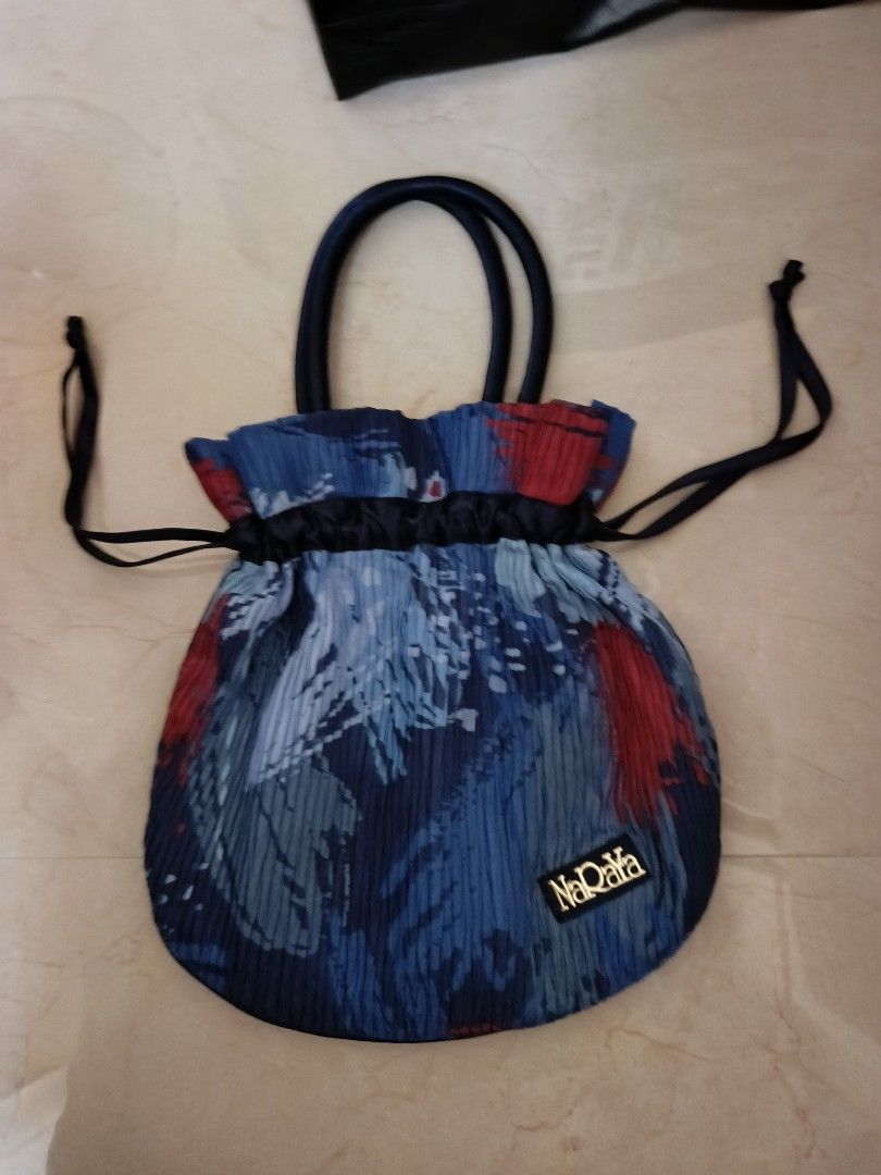 NaRaya Pleated Drawstring Bag - Blue Floral (Category: Shoulder Bags) located in Cabanatuan. Submitted by lyxyx (Listing ID 1459722516, Image 1). Description: - Cute pleated drawstring bag from NaDaya - Features a blue and red abstract floral print - Satin handles and drawstrings - Ideal for carrying your essentials - Unique textured fabric.