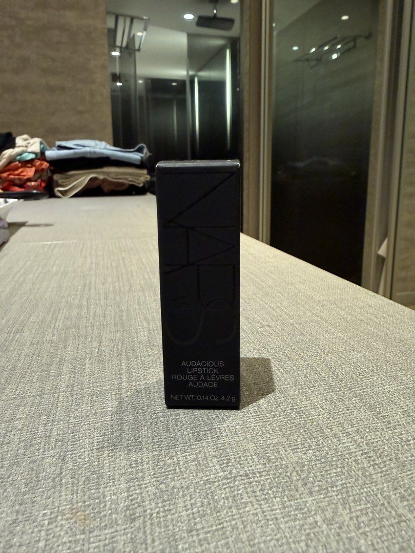 NARS Audacious Lipstick Rouge a Levres Audrey 9458 (Category: Makeup) located in Quezon City. Submitted by patpotpit (Listing ID 1459853226, Image 2). Description: - NARS Audacious Lipstick - Shade: Audrey (deep berry/plum) - Full-size: 4.2g - Includes original packaging - Ideal for a bold, statement lip look.
