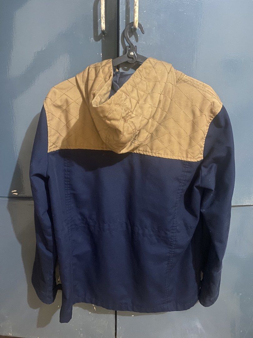 Quilted Hooded Jacket || packable jacket || workwear jacket (Category: Coats, Jackets and Outerwear) located in Manila. Submitted by alvarex (Listing ID 1459874279, Image 2). Description: - Stylish navy blue jacket - Tan quilted hood and upper chest panel - Button-up front closure - Multiple functional pockets - Adjustable drawstring at the waist for a custom fit - Ideal for cooler weather and a great look.