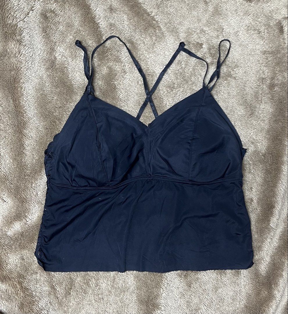 Black Lace Trimmed Cami Tank Top (Category: Sleeveless) located in Cavite. Submitted by bellewii (Listing ID 1459847572, Image 1). Description: - Navy blue cami tank top - Delicate lace trim on sides and back - Stylish criss-cross strap detail on the back - Built-in bra cups for added support - Versatile for layering or wearing as a standalone piece.