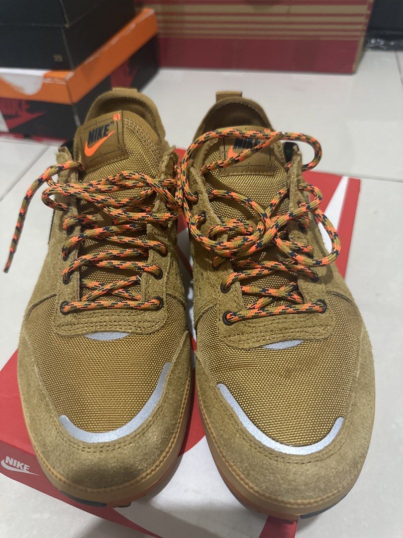 Nike city prm 265 (Category: Sneakers) located in Manila. Submitted by andy0729 (Listing ID 1459693282, Image 2). Description: - Brown Nike sneakers - Durable Cordura fabric on the sides - Unique orange and black speckled laces - Gum sole with vibrant orange accents - Ideal for outdoor adventures and casual style - Comes with the original box.