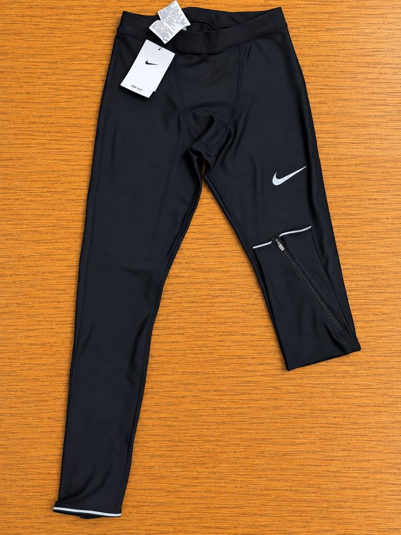 NIKE Dri-FIT Run Mobility Tights (Category: Activewear) located in Muntinlupa City. Submitted by cocofinds023 (Listing ID 1459825206, Image 1). Description: - Nike Dri-FIT technology wicks away sweat - Men’s Size M | Unisex Wear -Waist reference: 80 cm / 31.5 in - AT4242-010 - Unused • With Tags - Black / Reflective Silver 📍Muntinlupa City PF MOP : Gcash|Maya|Bank Transfer 🛵 Lalamove(Preferred for faster transaction) | J&T.