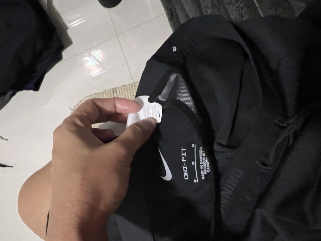 Nike Dri-Fit Running Pants Black Size M (Category: Activewear) located in Lapu Lapu. Submitted by chelon.865 (Listing ID 1459809312, Image 3). Description: - Black Nike Dri-Fit running pants - Made in Cambodia - Size M - Drawstring waist for adjustable fit - Ideal for workouts and running - Reflective details on the side for visibility - Please check photos for condition details.