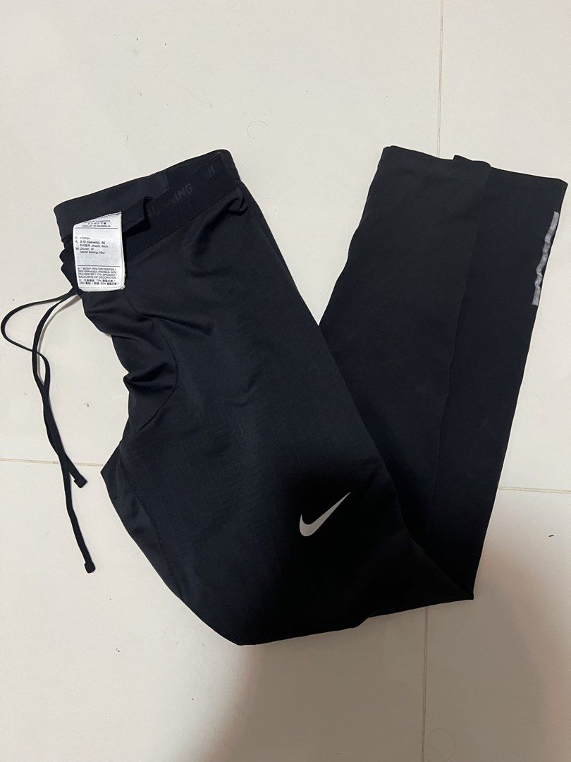 Nike Dri-Fit Running Pants Black Size M (Category: Activewear) located in Lapu Lapu. Submitted by chelon.865 (Listing ID 1459809312, Image 1). Description: - Black Nike Dri-Fit running pants - Made in Cambodia - Size M - Drawstring waist for adjustable fit - Ideal for workouts and running - Reflective details on the side for visibility - Please check photos for condition details.