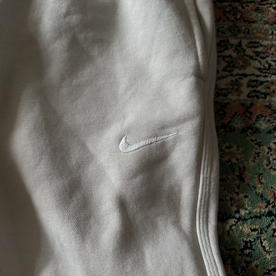 Nike Grey Fleece Sweatpants Size L (Category: Joggers) located in Manila. Submitted by vastocean_65397b (Listing ID 1459695119, Image 2). Description: - Grey Nike Sweatpants - Size: Large (L) - Made in Pakistan - Elastic waistband with drawstring for a comfortable fit - Convenient back pocket - Subtle embroidered Nike swoosh on the left leg - Ideal for lounging or casual everyday wear.