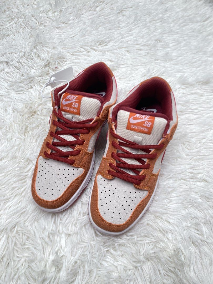 Nike SB Dunk Low Pro Orange White Red (Category: Sneakers) located in Valenzuela. Submitted by lotbi (Listing ID 1459832060, Image 1). Description: - Nike SB Dunk Low Pro sneakers - Vibrant orange, white, and red colorway - Size US 5 / UK 5 / EUR 37 - Made in Vietnam - Features Zoom Air cushioning for comfort - Brand new with original tags attached.