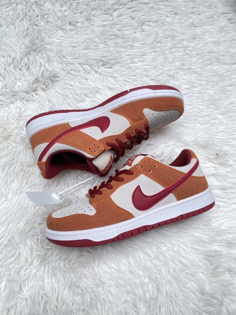 Nike SB Dunk Low Pro Orange White Red (Category: Sneakers) located in Valenzuela. Submitted by lotbi (Listing ID 1459832060, Image 2). Description: - Nike SB Dunk Low Pro sneakers - Vibrant orange, white, and red colorway - Size US 5 / UK 5 / EUR 37 - Made in Vietnam - Features Zoom Air cushioning for comfort - Brand new with original tags attached.