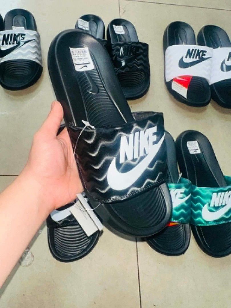 Nike Slides - Various Colors Available (Category: Slippers & Slides) located in Manila. Submitted by ashibambum_05 (Listing ID 1459692504, Image 2). Description: - Comfortable Nike slides for everyday wear. - Available in white, black, green, and silver. - Perfect for lounging or quick errands. - Easy to slip on and off..
