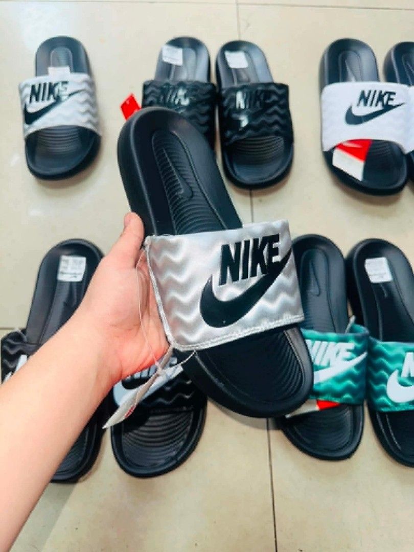 Nike Slides - Various Colors Available (Category: Slippers & Slides) located in Manila. Submitted by ashibambum_05 (Listing ID 1459692504, Image 3). Description: - Comfortable Nike slides for everyday wear. - Available in white, black, green, and silver. - Perfect for lounging or quick errands. - Easy to slip on and off..