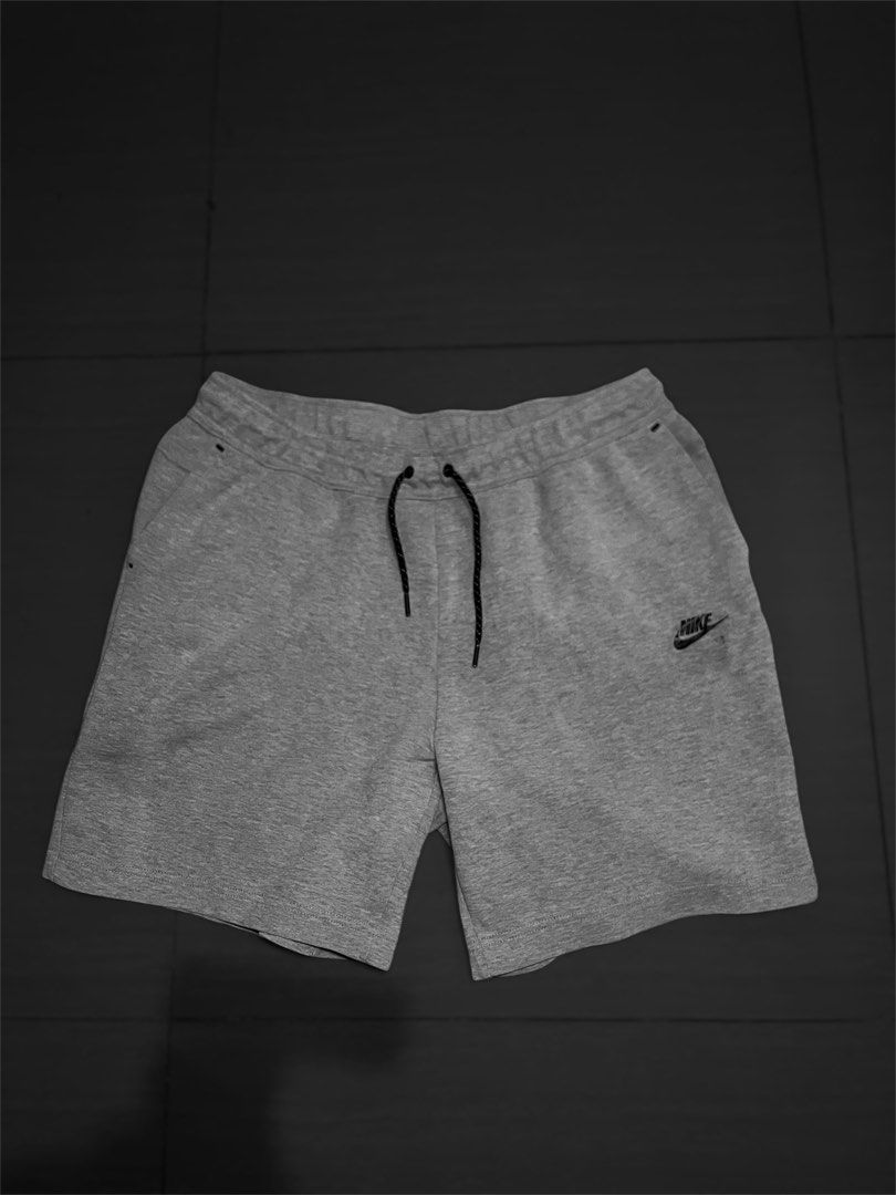 Nike Tech Fleece Grey Shorts XL (Category: Shorts) located in Lapu Lapu. Submitted by vanzfinds_16 (Listing ID 1459818162, Image 1). Description: - Grey Nike Tech Fleece shorts - Size XL - Elastic waistband with drawstring - Two side pockets - Nike logo on left leg - Made in Vietnam - Ideal for lounging or workouts.