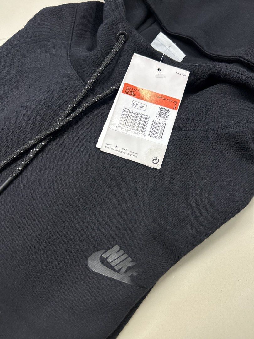 Nike Tech Fleece Hoodie Black (Category: Hoodies) located in Manila. Submitted by bodegabodega (Listing ID 1459773472, Image 3). Description: - Brand: Nike - Style: Tech Fleece Hoodie - Color: Black - Size: Large - Origin: Made in Cambodia - Features: Classic Nike logo on chest and sleeve, drawstring hood, front pocket - Condition: Brand new with tags - Ideal for: Everyday wear, training Nike Tech Fleece Hoodie Large Brandnew tags still intact Ne