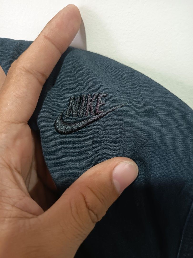 Nike Tech Pack Cargo Pants Dark Blue (Category: Joggers) located in Bago City. Submitted by nebg0699-24715 (Listing ID 1459898942, Image 3). Description: - Nike Tech Pack cargo pants - Elastic waistband with buckle closure - Embroidered Nike Swoosh logo on front - Smaller Swoosh detail on leg - Back pocket - Comfortable fit for everyday wear -Excellent condition -Small -30-32 waist -38.5 lenght + shipping 📩.