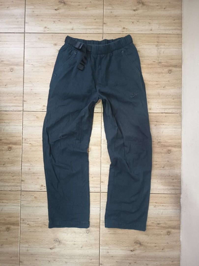Nike Tech Pack Cargo Pants Dark Blue (Category: Joggers) located in Bago City. Submitted by nebg0699-24715 (Listing ID 1459898942, Image 1). Description: - Nike Tech Pack cargo pants - Elastic waistband with buckle closure - Embroidered Nike Swoosh logo on front - Smaller Swoosh detail on leg - Back pocket - Comfortable fit for everyday wear -Excellent condition -Small -30-32 waist -38.5 lenght + shipping 📩.