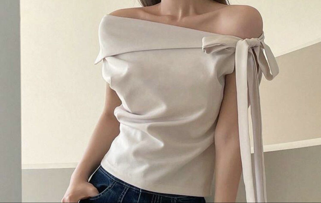 Off Shoulder Bow Detail Top (Category: Blouses) located in Quezon City. Submitted by kimibery (Listing ID 1459751680, Image 1). Description: - Cute off-shoulder design - Pretty bow detail on the side - Soft and comfortable fabric - Perfect for dressing up or down - Pairs well with jeans or skirts - Easy to wear and style - S-M.