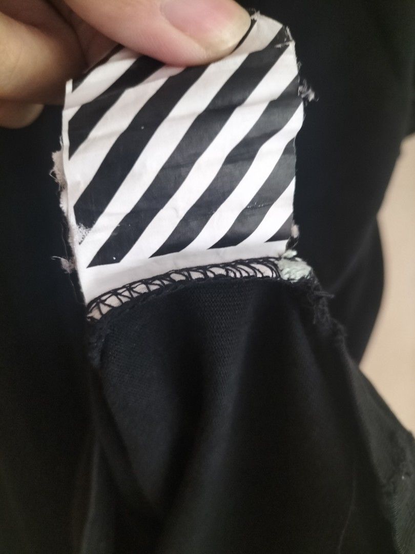 Off-White Main Label (Large) (Category: Tshirts & Polo Shirts ) located in Cavite. Submitted by taro_sakamoto_23 (Listing ID 1459724632, Image 3). Description: - Official Off-White - Authentic - Complete tags 💯 - Heavy Cotton - 9.5/10 color rate honest Issue: - Pinholes lang sa necktag need tahi.