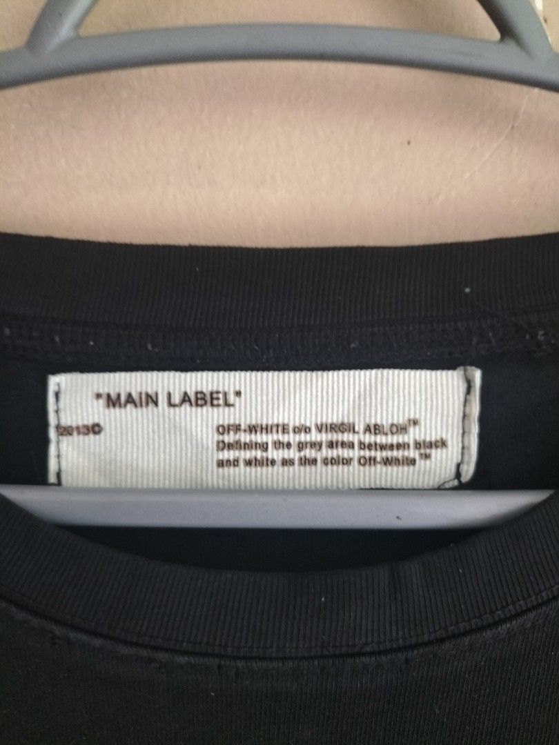 Off-White Main Label (Large) (Category: Tshirts & Polo Shirts ) located in Cavite. Submitted by taro_sakamoto_23 (Listing ID 1459724632, Image 2). Description: - Official Off-White - Authentic - Complete tags 💯 - Heavy Cotton - 9.5/10 color rate honest Issue: - Pinholes lang sa necktag need tahi.