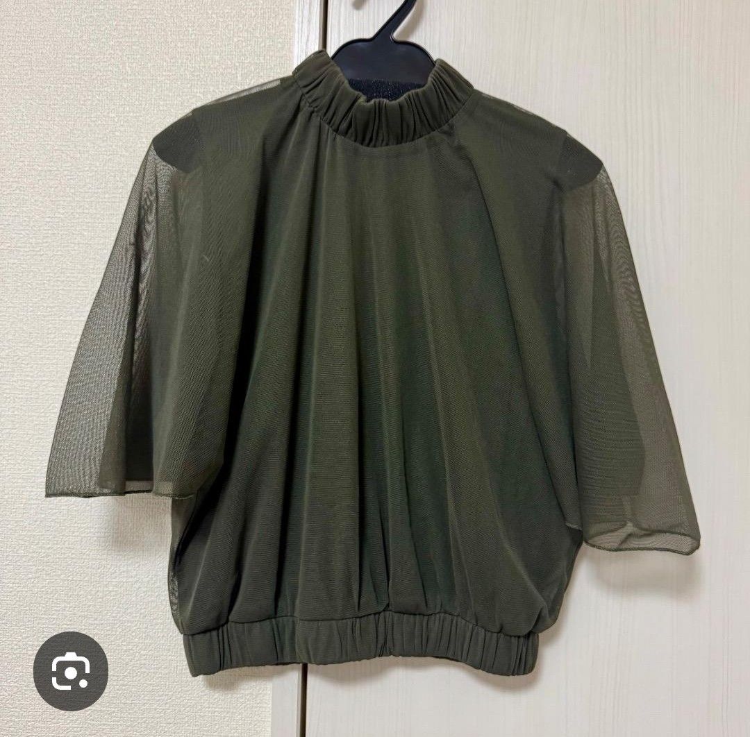 Olive Green Mesh Mock Neck Top with Back Cutout (Category: Blouses) located in Tarlac. Submitted by momma02 (Listing ID 1459777269, Image 1). Description: - Olive green mesh top - Mock neck with gathered detail - Short, sheer sleeves - Elasticated hem - Open back with a cutout - Made of polyester - Versatile for layering or wearing solo -very nice formal top💚.
