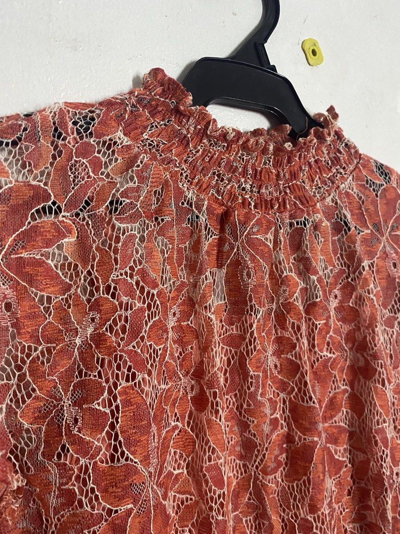 Orange Lace Mock Neck Sleeve Top (Category: Blouses) located in Makati City. Submitted by k.sainz (Listing ID 1459770845, Image 2). Description: - Elegant orange lace top with a delicate floral pattern. - Comes with a comfortable matching camisole..