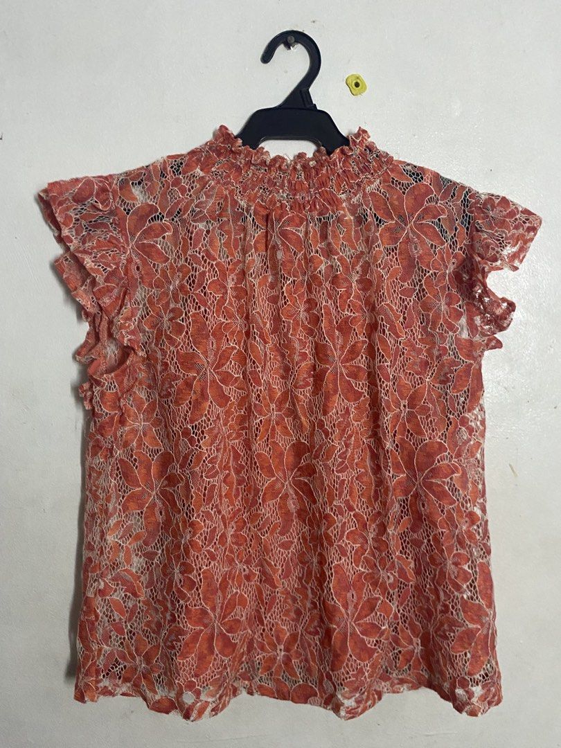 Orange Lace Mock Neck Sleeve Top (Category: Blouses) located in Makati City. Submitted by k.sainz (Listing ID 1459770845, Image 1). Description: - Elegant orange lace top with a delicate floral pattern. - Comes with a comfortable matching camisole..