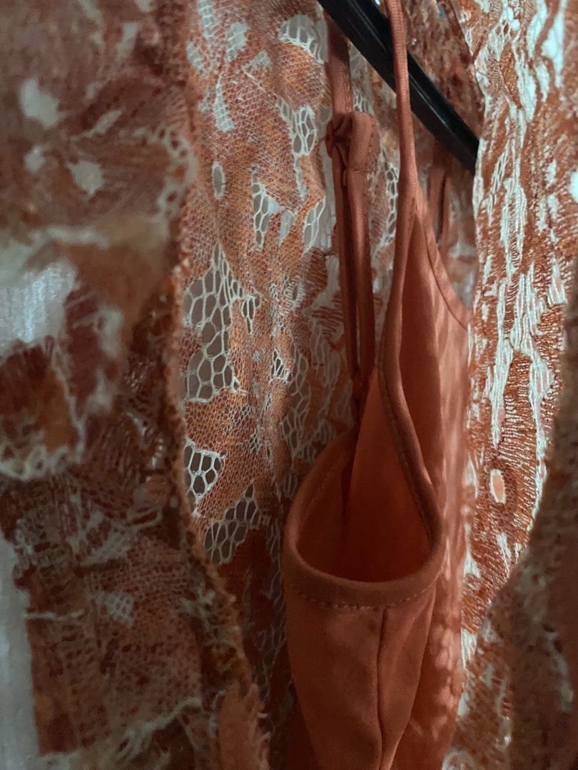 Orange Lace Mock Neck Sleeve Top (Category: Blouses) located in Makati City. Submitted by k.sainz (Listing ID 1459770845, Image 3). Description: - Elegant orange lace top with a delicate floral pattern. - Comes with a comfortable matching camisole..