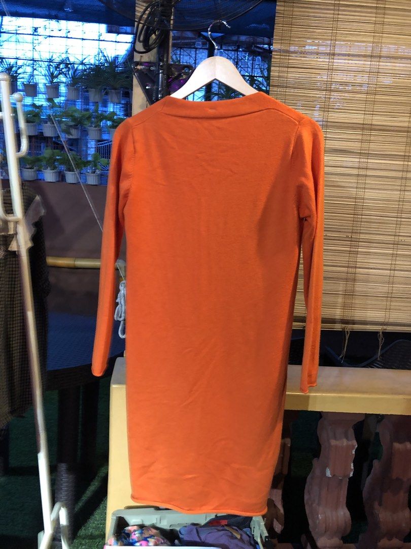Orange Longline Cardigan with Pockets (Category: Coats, Jackets and Outerwear) located in Cauayan City . Submitted by wholly.craaaft (Listing ID 1459799003, Image 3). Description: - Orange longline cardigan - V-neck with single button closure - Two front pockets - Long sleeves - Ideal for layering on cooler days - Versatile styling with jeans or leggings.