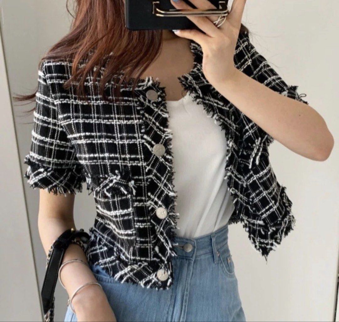 ORIGINAL Black & White Plaid Tweed Cropped Jacket (Category: Coats, Jackets and Outerwear) located in Manila. Submitted by decluterthings888 (Listing ID 1459874827, Image 2). Description: - Black and white plaid cropped jacket - Frayed trim on collar, pockets, and hem - Button front closure - Versatile style: pairs well with jeans or skirts - Chic and trendy look.