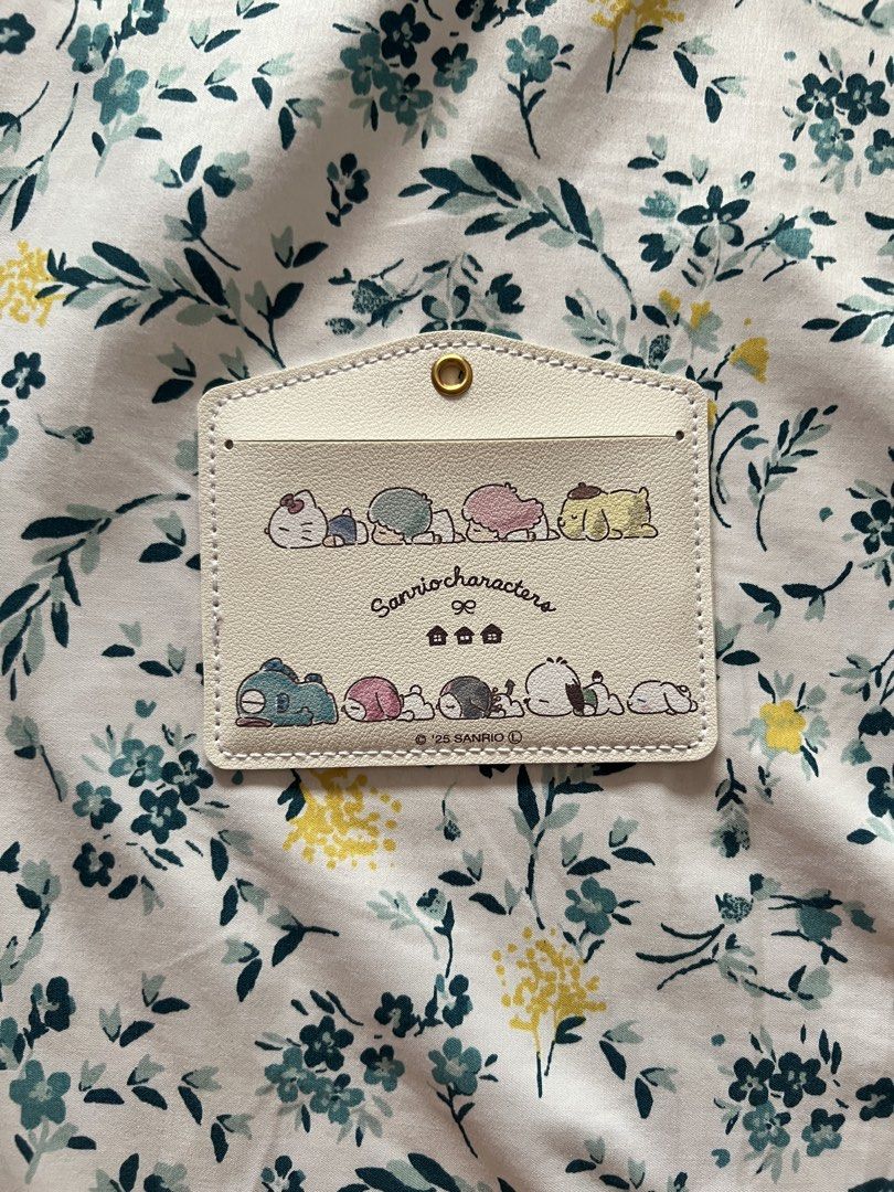 Original Sanrio Characters ID Card Holder Case (Category: Wallets & Card holders) located in Tacloban City. Submitted by jojosfrills (Listing ID 1459741193, Image 3). Description: Original Sanrio Characters ID Card Holder Case - White colored with various Sanrio character prints - Clear window for your ID - Secure snap closure - Ideal for school or work - Keeps your ID safe and stylish.