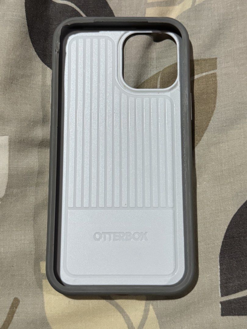 Otterbox Iph 12 Pro max (Category: Cases & Sleeves) located in Obando. Submitted by pepperooshop (Listing ID 1459713654, Image 2). Description: - Brand: Otterbox - Compatible with: iPhone 12 Pro Max - Color: White and Gray - Condition: Good, shows minimal signs of use - Features: Durable protection against drops and scratches - - Iph 12 pro max -rfs:decluttering.