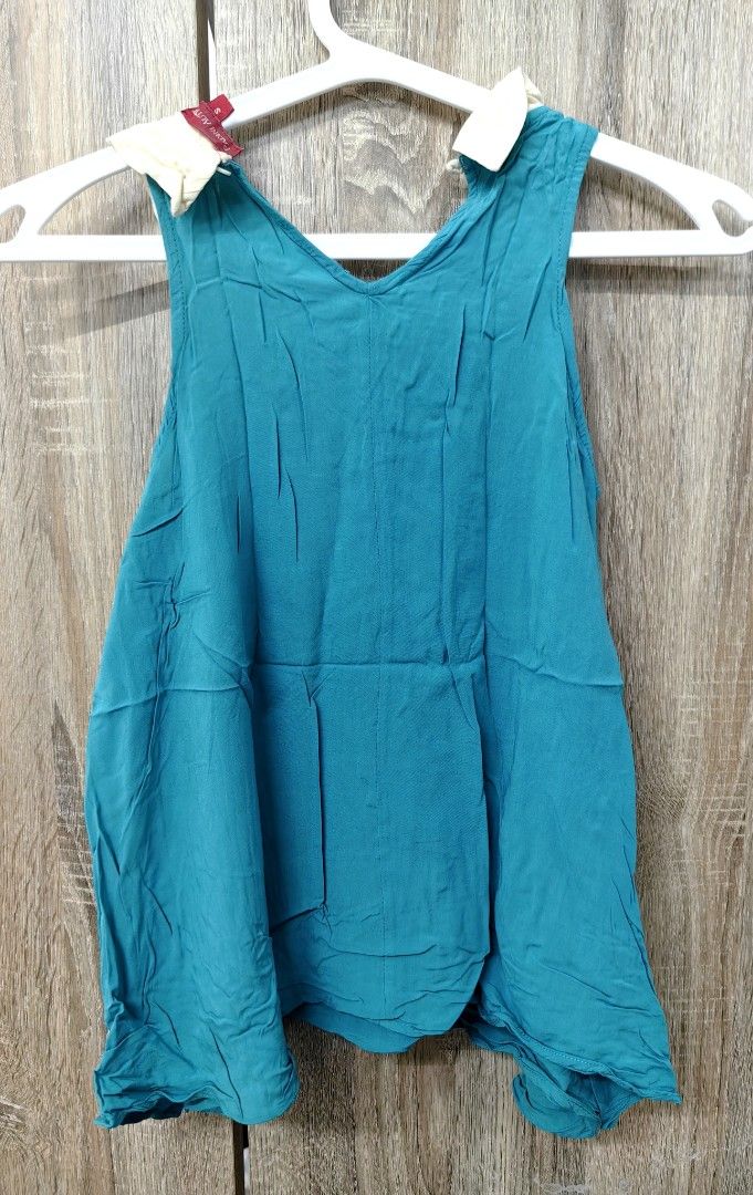 Padini Authentics Teal Sleeveless Top with Collar Size S (Category: Sleeveless) located in Las Pinas. Submitted by offtonewhome (Listing ID 1459786697, Image 2). Description: - Teal sleeveless top from Padini Authentics - Features a cute cream collar detail - Size: S - Ideal for casual wear or layering - Easy to style.