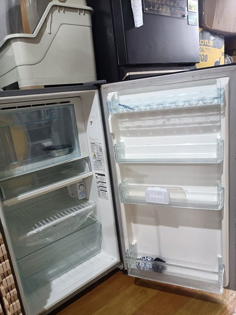 Panasonic Mini Fridge (Category: Refrigerators and Freezers) located in Makati City. Submitted by marisong30 (Listing ID 1459897008, Image 3). Description: DECLUTTER SALE: Panasonic NR-AQ151NS Refrigerator Well-used but still working and cooling/freezing properly. Selling because we recently upgraded to a bigger refrigerator. Honest condition: ✅ Cooling/freezing works properly ⚠️ Small crack on the freezer door, does not affect cooling ⚠️ Interio