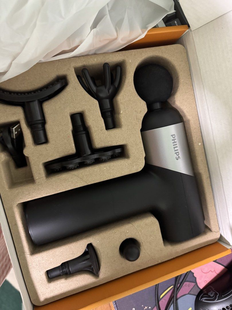 Philips Smart Control Massage Gun (Category: Massage Devices) located in Pasig City. Submitted by denisse014 (Listing ID 1459751308, Image 2). Description: - Philips massage gun for deep tissue relief - Smart control for adjustable frequency - Includes multiple attachments for various muscle groups - USB charging cable included - Ideal for post-workout recovery.