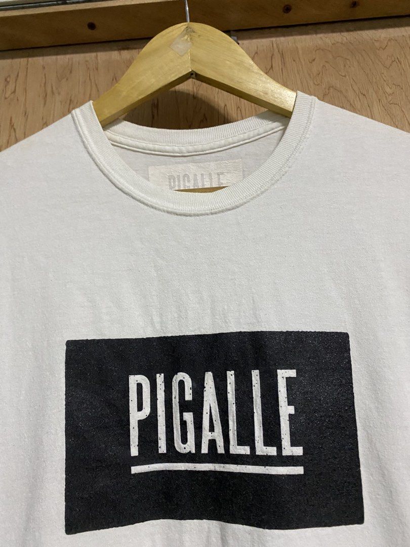 PIGALLE White T-shirt (Category: Tshirts & Polo Shirts ) located in Manila. Submitted by callejage69430 (Listing ID 1459772784, Image 2). Description: 20 width 28 length Need wash - Classic white PIGALLE t-shirt - Features the iconic PIGALLE logo in a black box on the front - Simple and timeless design - Ideal for casual everyday wear.