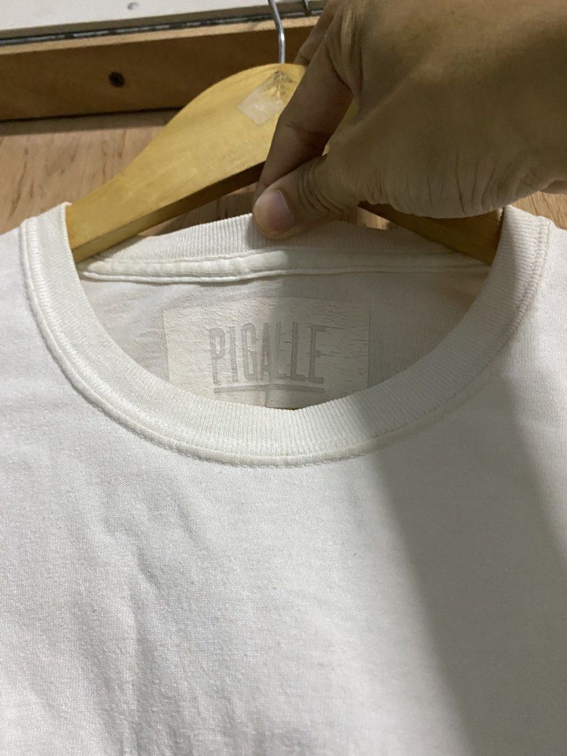 PIGALLE White T-shirt (Category: Tshirts & Polo Shirts ) located in Manila. Submitted by callejage69430 (Listing ID 1459772784, Image 3). Description: 20 width 28 length Need wash - Classic white PIGALLE t-shirt - Features the iconic PIGALLE logo in a black box on the front - Simple and timeless design - Ideal for casual everyday wear.