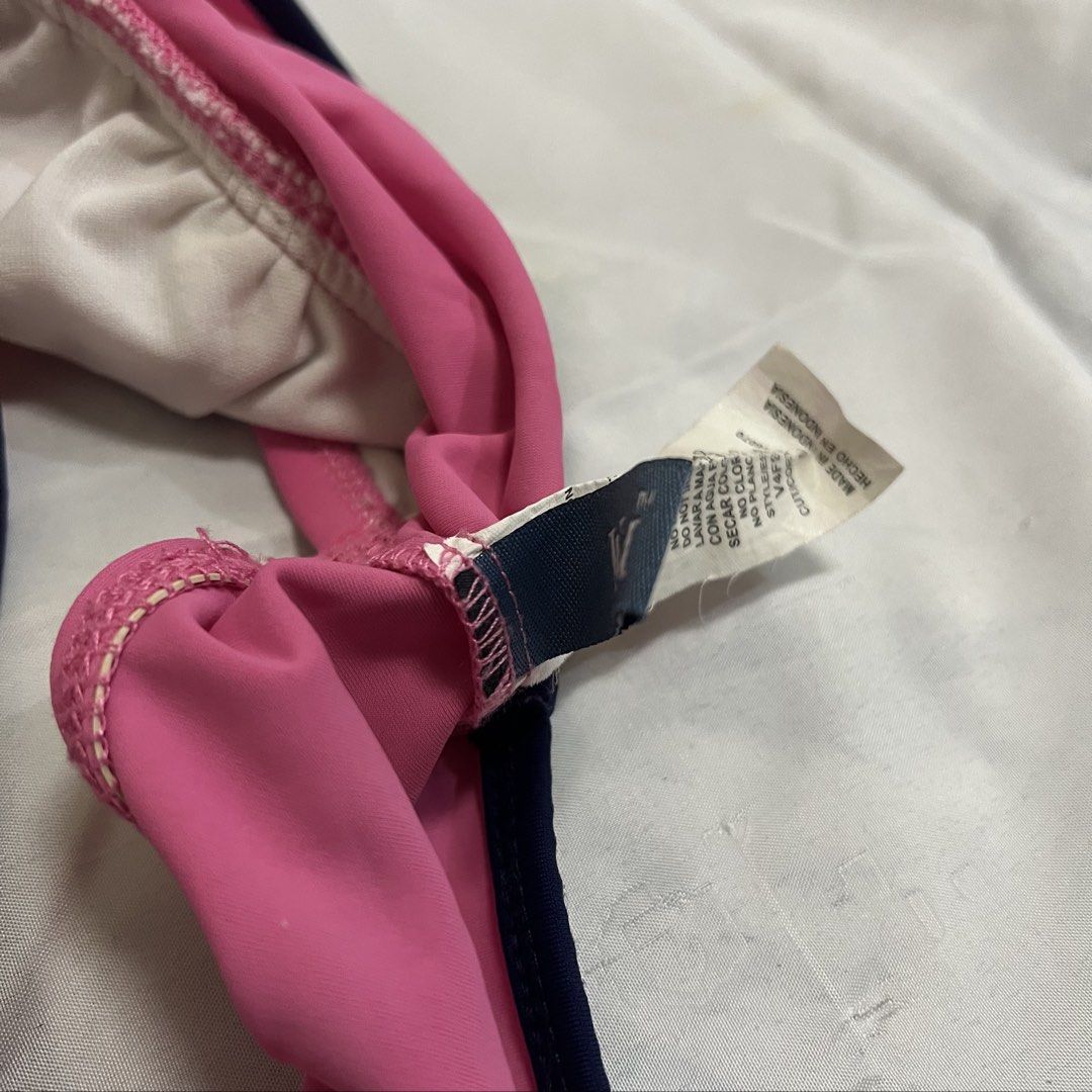 Pink Halter Bikini Top with Navy Trim (Category: Bikinis & Swimsuits) located in Imus. Submitted by niftees.eco (Listing ID 1459749768, Image 3). Description: - Cute pink halter bikini top - Ties at neck and back - Ruching detail on cups - Navy blue trim along bottom edge - Ideal for beach or pool.