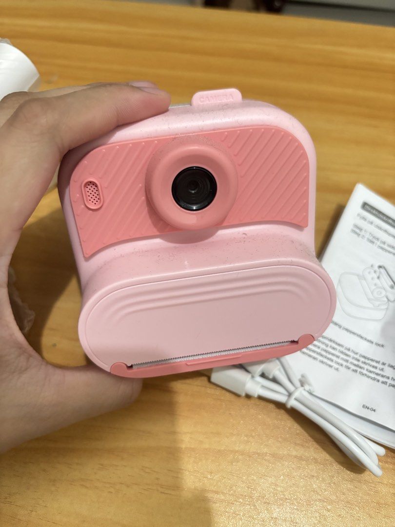 Pink Instant Print Camera with Paper Rolls & USB Cable (Category: Cameras) located in Manila. Submitted by jenshiii11 (Listing ID 1459824273, Image 2). Description: - Adorable pink instant print camera - Features a colorful screen with camera, video, and game functions - Comes with multiple rolls of printing paper - Includes USB charging cable - Easy to use for all ages - Ideal for capturing and printing memories on the go RFS: di nagagamit, use 