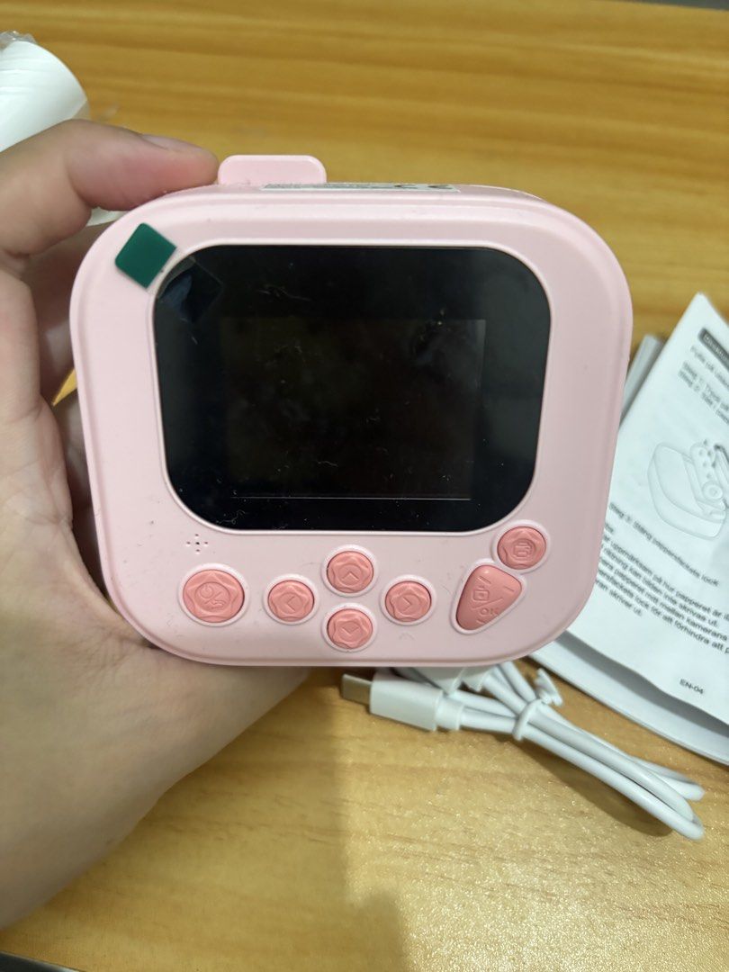 Pink Instant Print Camera with Paper Rolls & USB Cable (Category: Cameras) located in Manila. Submitted by jenshiii11 (Listing ID 1459824273, Image 3). Description: - Adorable pink instant print camera - Features a colorful screen with camera, video, and game functions - Comes with multiple rolls of printing paper - Includes USB charging cable - Easy to use for all ages - Ideal for capturing and printing memories on the go RFS: di nagagamit, use 