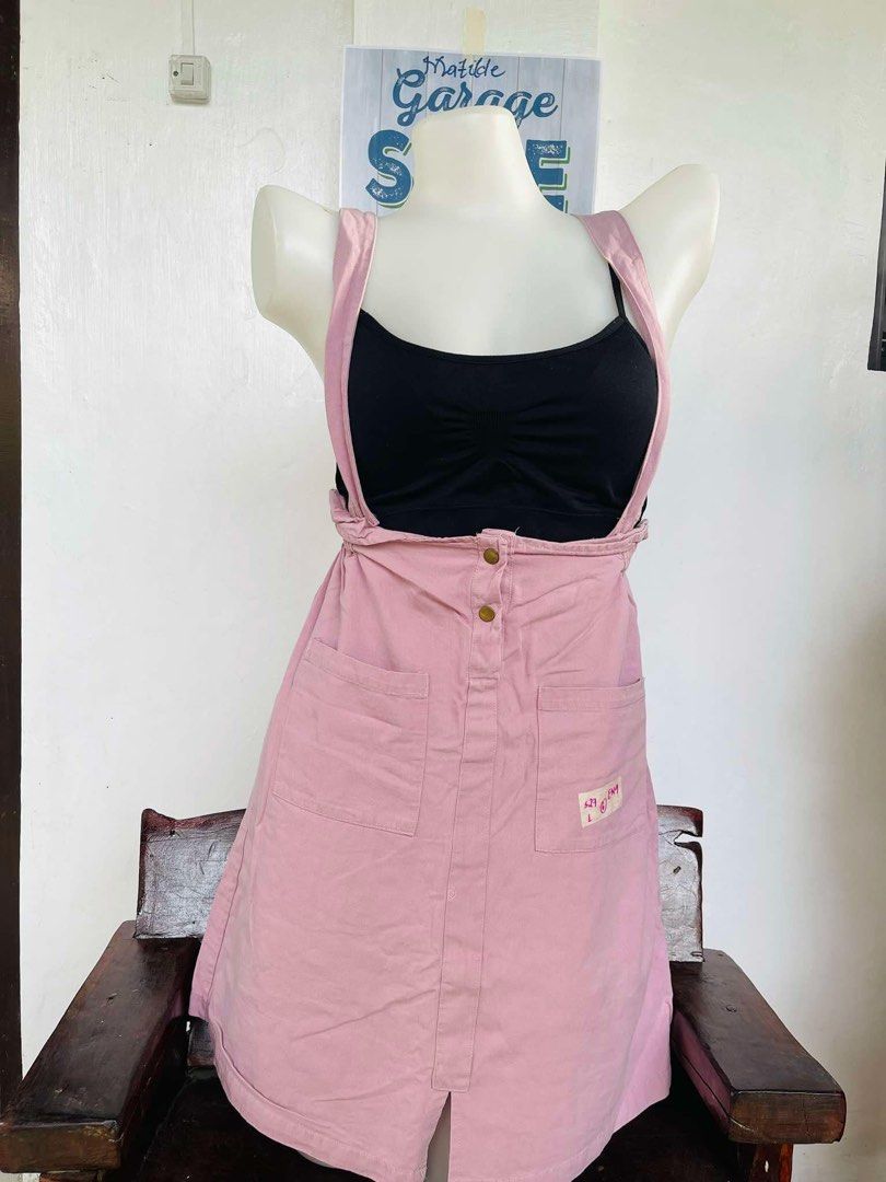 Pink Overall Dress with Pockets (Category: Dresses) located in Indang. Submitted by matilde.sshop (Listing ID 1459860710, Image 1). Description: - Adorable pink overall dress - Features two front pockets - Adjustable straps for a perfect fit - Button details for added style - Versatile for layering (looks great over a black top!) - Ideal for casual outings - Effortless to wear and style.